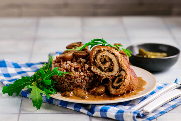 Beef rolls with mushrooms and sauce. rustic style