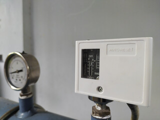 a pressure control switch installed on the pipe water pressure.