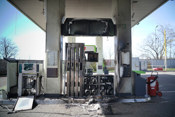 Gas station with a broken station from a shell explosion. Exploded gas station during the war.