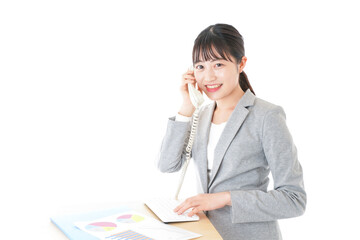 Young businesswoman using business phone at office