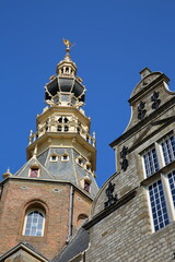 Fototapeta na wymiar Close-up on the impressive decorated tower of the Stadhuis (Town Hall) in Zierikzee, Zeeland, Netherlands