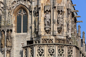 Close-up on statues and ornaments (Dutch Gothic architecture) on the external facade the gothic...