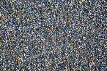 Colorful small pebbles or stone on sea pebble beach as background