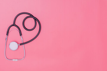 Obraz na płótnie Canvas stethoscope on pink background and copy space