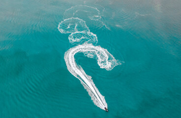 Boats and speedboats on the surface of the sea