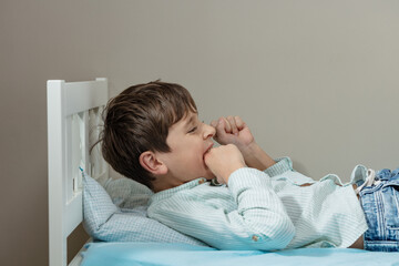 Autistic boy bite hand with strong negative face expression