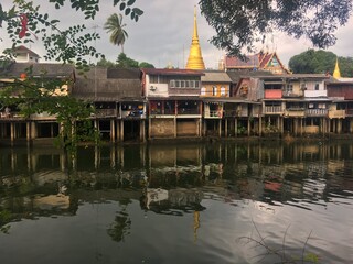 The city of Chantaburi on the lake with a pagoda in the background 