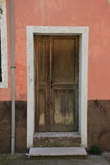 Italy: Old wooden ruined door.