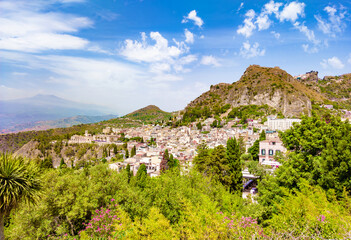 Fototapeta na wymiar Taormina (Sicilia, Italy) - A historical center view of the touristic city in province of Messina, Sicily island, during the summer, famous for Isola Bella beach and the old theatre