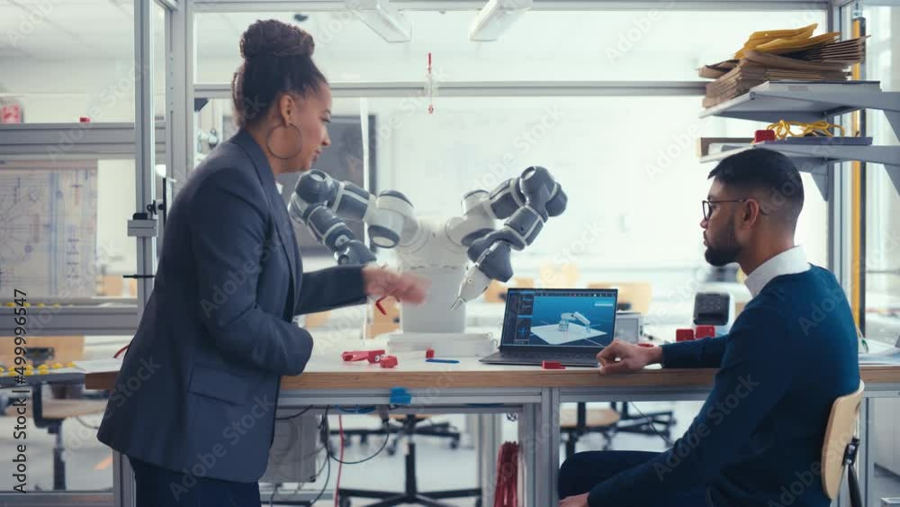 Poster black chief engineer discussing futuristic robotic arm with young promising computer scientist man w