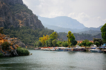 Tourist boats moored by the side of the Dalyan River - 499998114