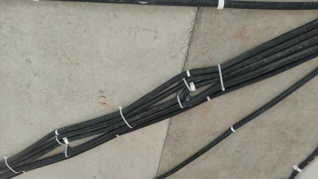Electric wiring in black corrugation laid on the ceiling