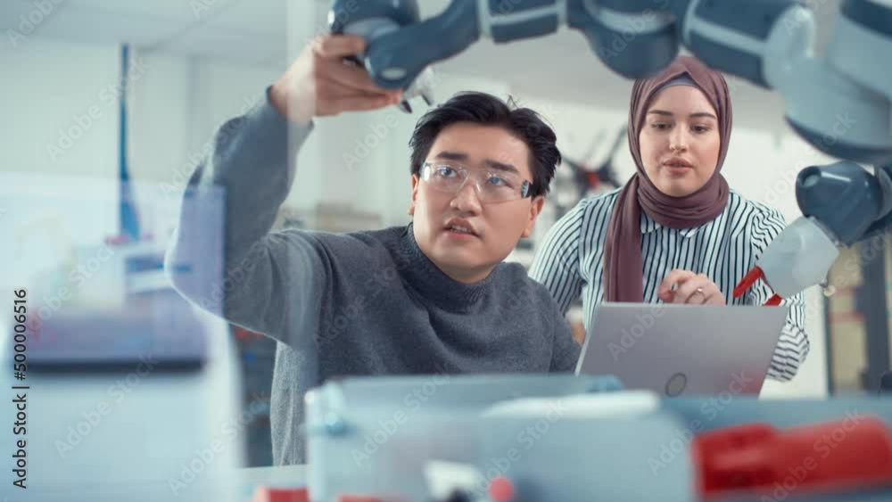 Poster arabic female future engineer look how work skilful developer. asian man explains and examining robo