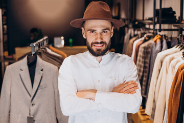 Man looking for hat at mens store