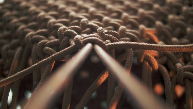 Strong tightening of a knot on a rope with weaving