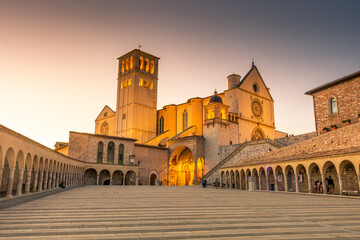 ASSISI, ITALY, 6 AUGUST 2021 Sunset over the San Francesco Basilica, one of the most important...