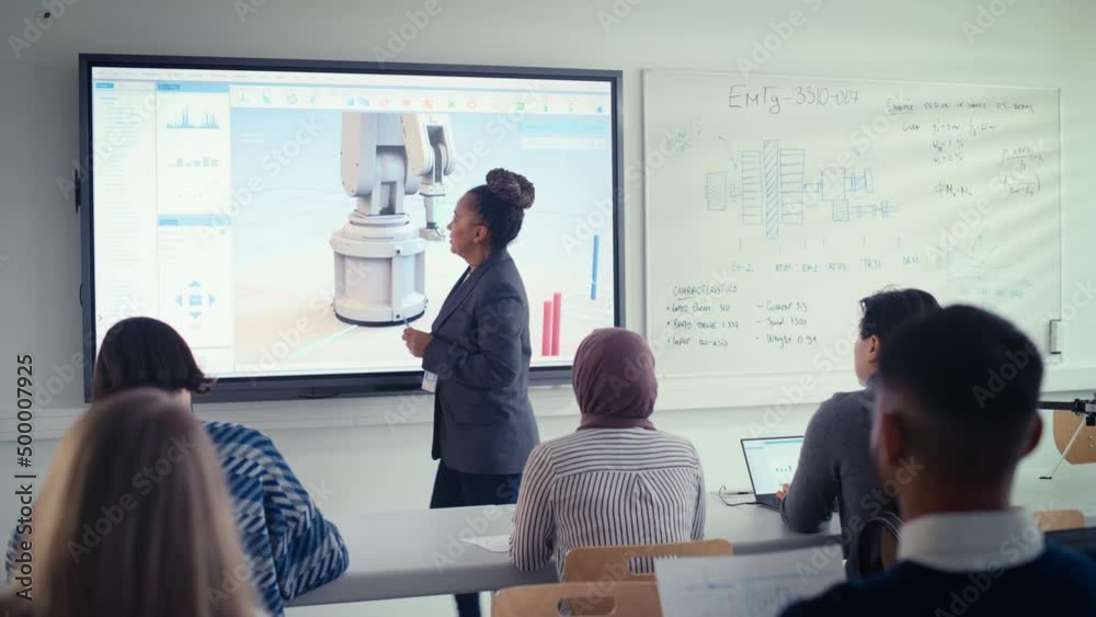 Leinwandbilder female educator standing near projection screen and explaining to diverse students about innovations