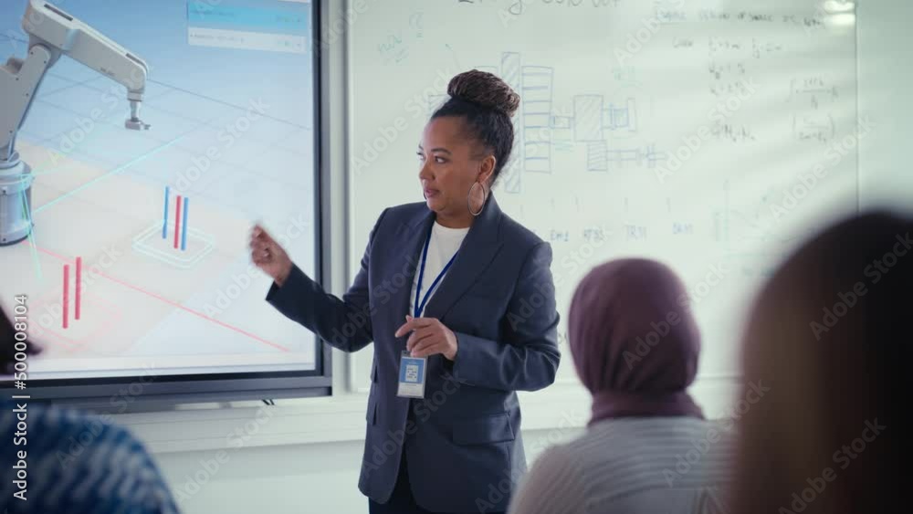 Poster Teacher Holding Lesson to Diverse Students while Showing at Robotic Hand and Fluctuations in Data on Charts at projection screen  in University. Robotic Engineering Concept. Close up view
