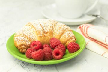Croissants and fresh raspberries, Fresh and delicious croissants.