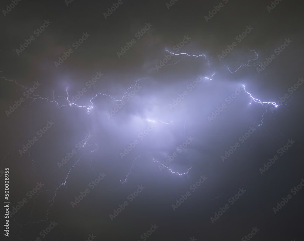 Wall mural Background of Lightning thunderstorm on stormy dark sky