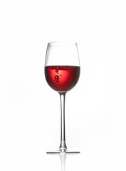 red wine in a transparent glass with reflection isolated over white background