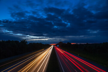 Night traffic scene with light trails on highway long exposure