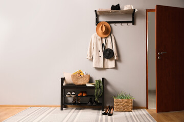 Hallway interior with stylish furniture, clothes and accessories - obrazy, fototapety, plakaty