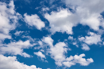 White cumulus clouds in blue sky, beautiful cloudscape background