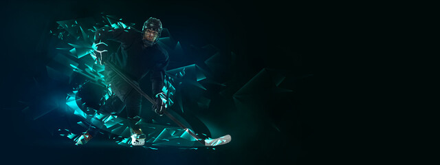 Obraz na płótnie Canvas Young man, professional hockey player in protective uniform training isolated on dark background polygonal, fluid neon elements. Concept of sport