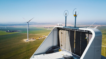 Aerial view of close up windmill turbine in countryside area, Wind power and renewable sustainable...
