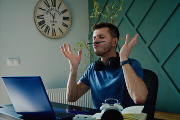 Unproductive lazy man have fun in workplace at home, Male freelancer procrastinating at remote work