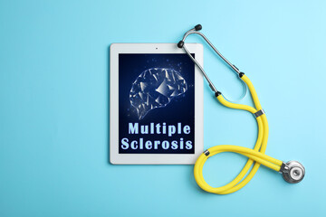 Multiple Sclerosis concept. Stethoscope and tablet on turquoise background, flat lay