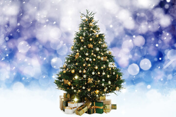 Beautifully decorated Christmas tree on blue background. Bokeh effect