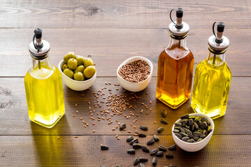 Vegetarian cooking oil in bottles. Sunflower olive and sesame oil with ingredients
