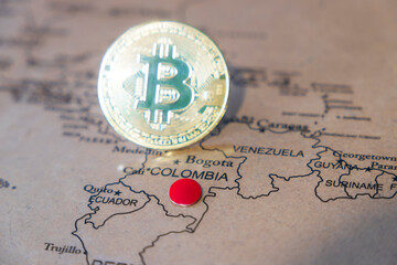 Bitcoin symbol  standing on the world map, Colombia is pinned on the map