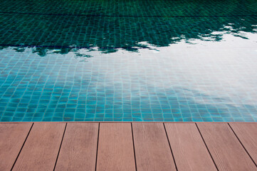 Top view of wooden floor of swimming pool. Copy space concept