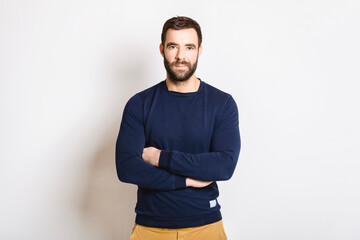 portrait of casual young man with beard white background