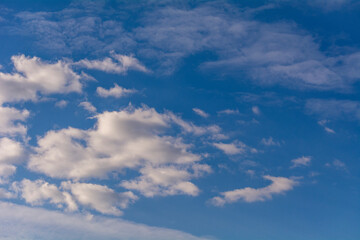 White clouds in the blue sky.