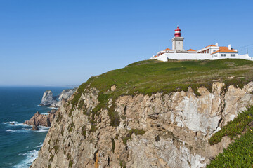 Fototapeta na wymiar Lighthouse at Cape Roca, Westernmost extent of Europe, Lisbon Coast, Portugal