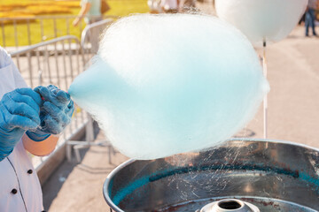 cotton candy is being prepared on a city holiday