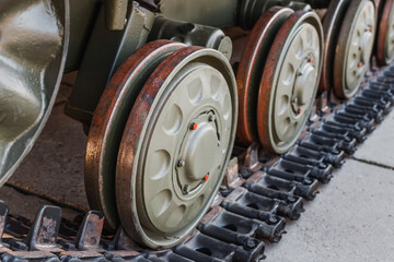 the caterpillar of a heavily armed military tank. The concept of a fire conflict