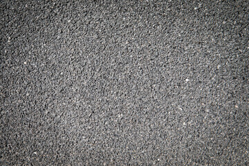 Gray plaster background. Surface of small stones