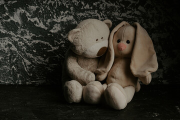 Stuffed toys teddy bear hugs bunny. Psychological help for children concept