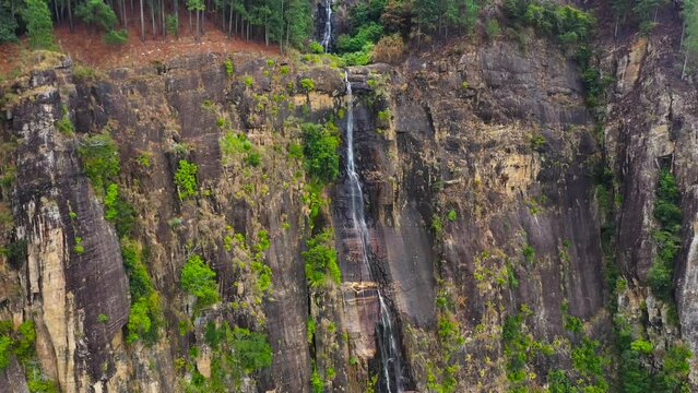 Waterfall in the jungle. Bambarakanda Falls in the rainforest. Sri Lanka.