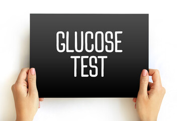 Glucose Test - measures the glucose levels in your blood, text concept on card