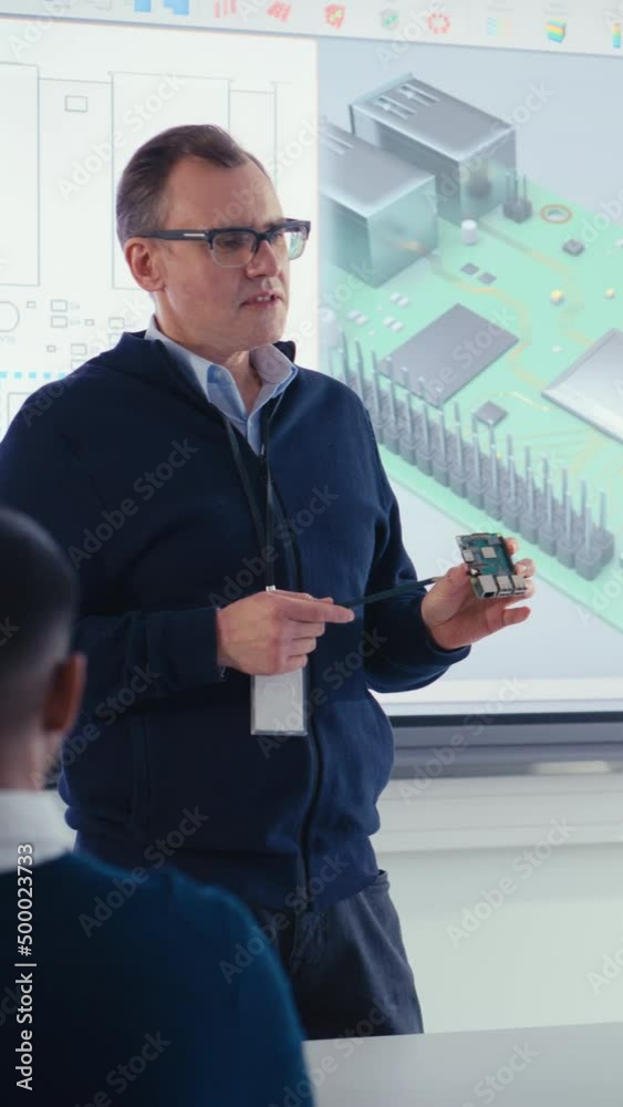 Poster Confident Male Teacher Using Digital Interactive Screen, Talk to Group of Students and Showing 3D Printed Circuit Board. Education and High Tech Concept. Vertical Video