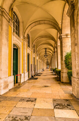 Fototapeta premium A view of down a corridor in the Alfama distict in the city of Lisbon on a spring day