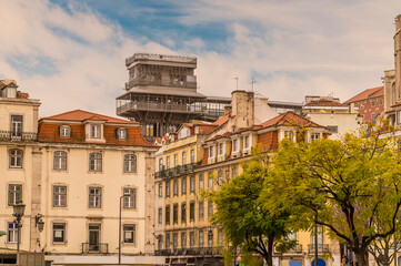 Obraz premium A view across the Central Square towards the Holy Fair lift in the Alfama distict in the city of Lisbon on a spring day