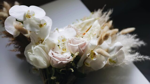 A bouquet of live flowers is taken from above in close-up. The camera moves smoothly