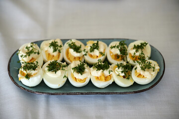 Boiled sliced eggs dressed with cress on a plate